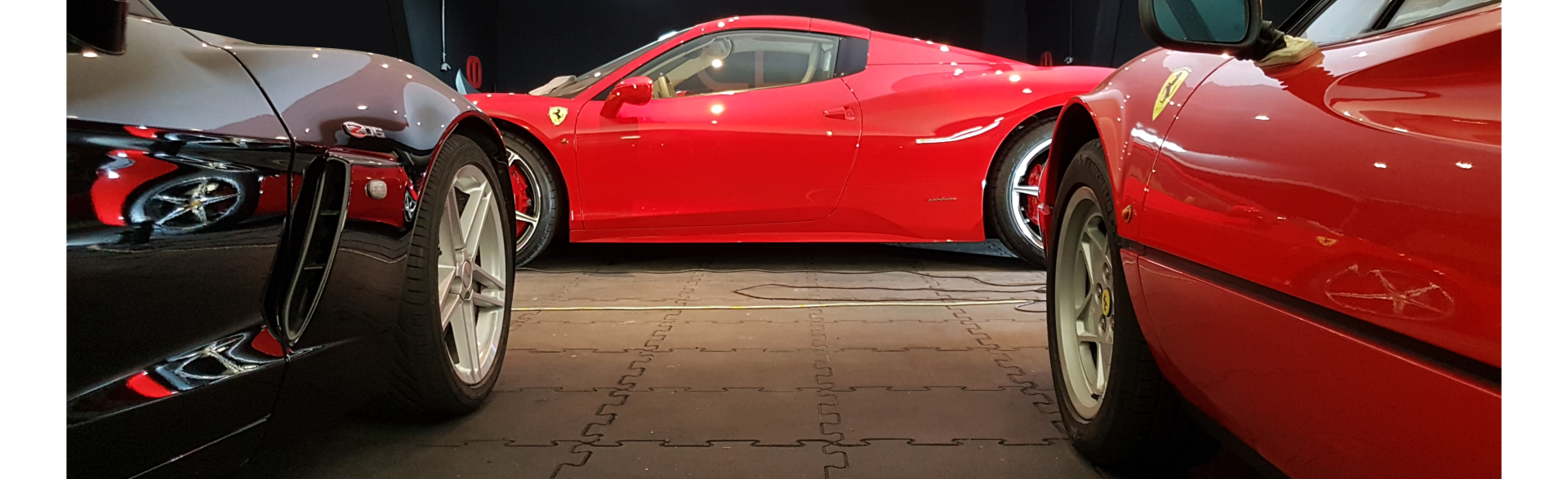 Virtuoso Detailing team working on a luxury car